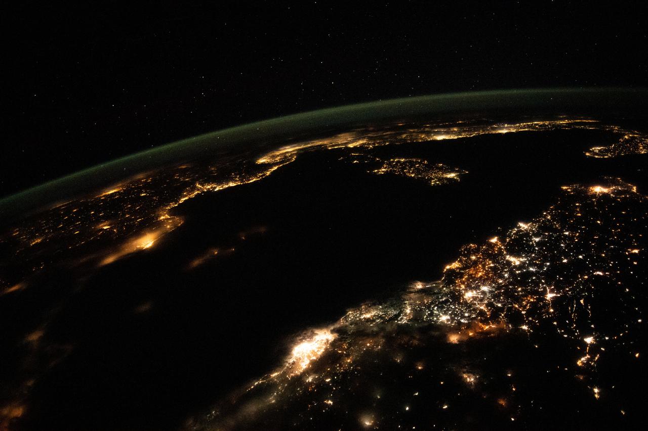 iss067e302248 (Aug. 31, 2022) --- This night time photograph from the International Space Station as it orbited 261 miles above looks across the Mediterranean Sea from north Africa to southern Europe. The city lights of Algiers, Algeria, to Tunis, Tunisia, highlight Africa's northern coast from the bottom center toward upper right. From far left, the city lights of city-state Monaco to Naples, Italy, define the shores of southern Europe. The French island of Corsica and the Italian island of Sardinia are also pictured.