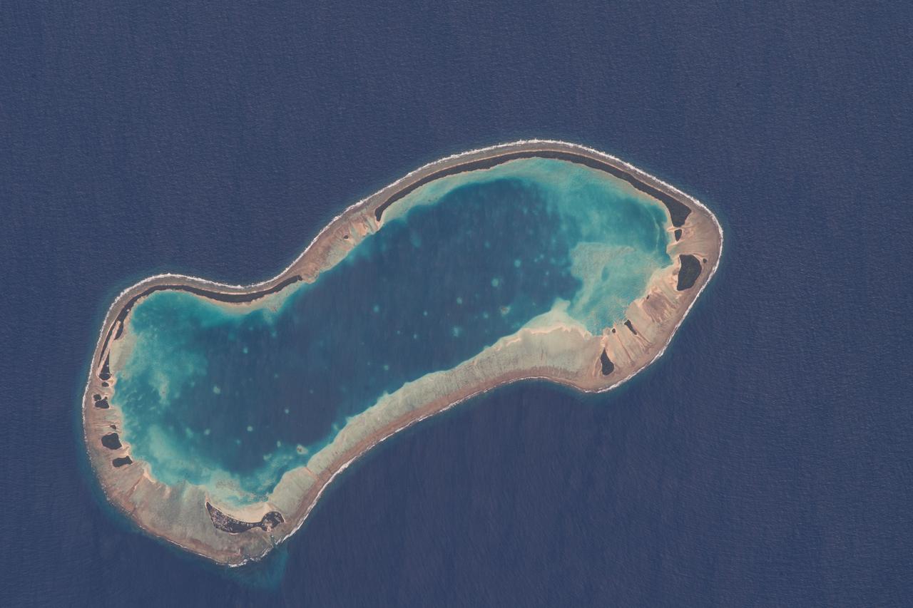 iss067e315980 (Sept. 4, 2022) --- The Niuoku Islet, part of the island nation of Tuvalu, is pictured from the International Space Station as it orbited 259 miles above the southern Pacific Ocean.