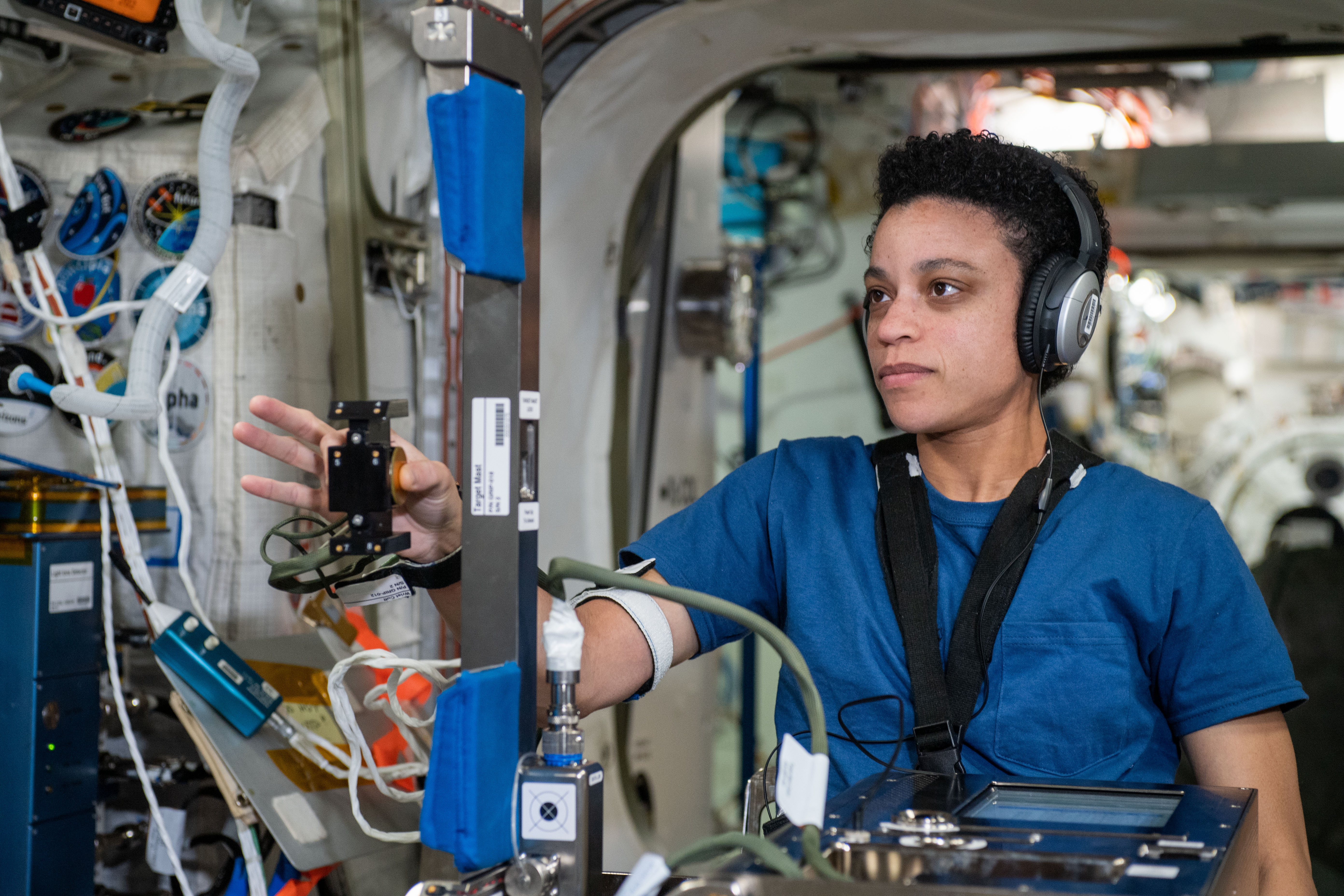 iss067e360645 (July 6, 2022) --- NASA astronaut and Expedition 67 Flight Engineer Jessica Watkins is seated inside the Columbus laboratory module participating in the GRIP experiment. The investigation explores how astronauts grip and maneuver a specialized device in response to pre-programmed stimuli so scientists can gain insights into a crew member’s cognition and perception during spaceflight.