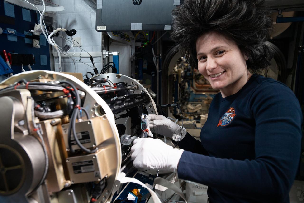 iss067e367893 (Sept. 15, 2022) --- ESA (European Space Agency) astronaut and Expedition 67 Flight Engineer Samantha Cristoforetti works inside the International Space Station's Unity module reconfiguring components for the Solid Fuel Ignition and Extinction investigation that explores fire growth and fire safety techniques in space.