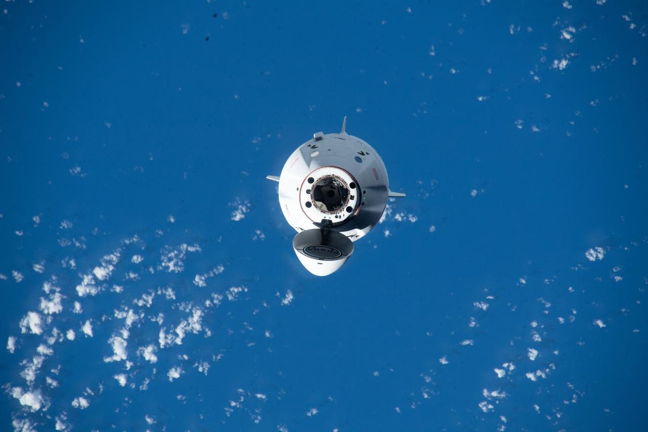 iss068e014159 (Oct. 6, 2022) --- The SpaceX Dragon Endurance crew ship, carrying four Crew-5 members, approaches the International Space Station 260 miles above the Pacific Ocean southwest of the Hawaiian island chain. Credit: NASA/Kjell Lindgren