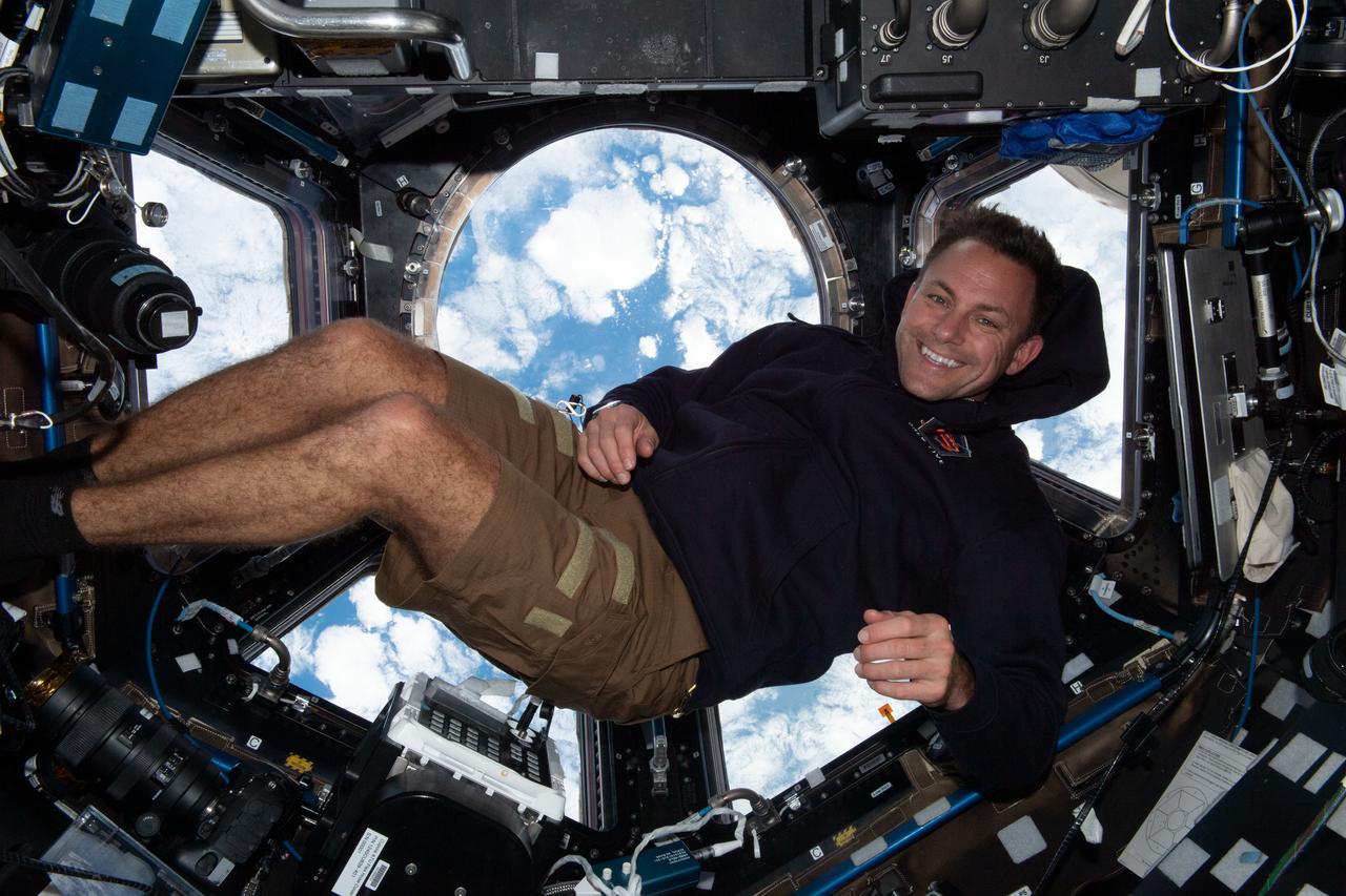 iss068e017849 (Oct. 22, 2022) --- NASA astronaut and Expedition 68 Flight Engineer Josh Cassada is pictured inside the cupola, the International Space Station's "window to the world," as the orbiting lab flew 264 miles above the Pacific Ocean off the coast of Peru. Credit: NASA/Nicole Mann