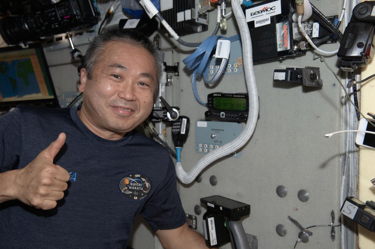 iss068e018996 (Oct. 24, 2022) --- Expedition 68 Flight Engineer Koichi Wakata of the Japan Aerospace Exploration Agency (JAXA) gives a "thumbs up" after powering on the Zvezda service module's ham radio aboard the International Space Station. Credit: JAXA/Koichi Wakata