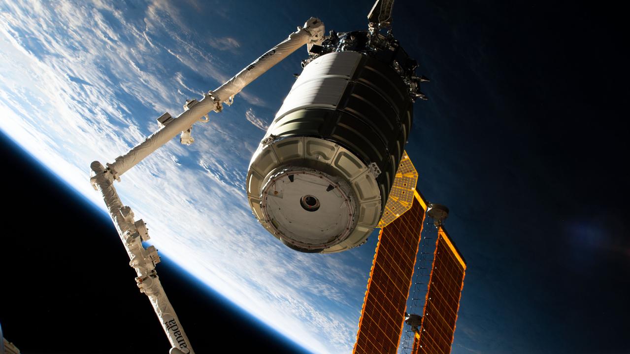 iss068e021319 (Nov. 9, 2022) --- The Northrop Grumman Cygnus space freighter is pictured in the grip of the Canadarm2 robotic arm and being maneuvered toward the International Space Station's Unity module for installation.