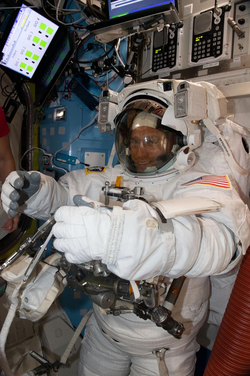 iss068e022317 (Nov. 15, 2022) --- NASA astronaut and Expedition 68 Flight Engineer Frank Rubio is pictured suited up inside his Extravehicular Mobility Unit (EMU), or spacesuit, before beginning a seven-hour and 11-minute a spacewalk to ready the orbiting lab's starboard truss structure for future rollout solar array installation work. Credit: Koichi Wakata/Japan Aerospace Exploration Agency (JAXA)