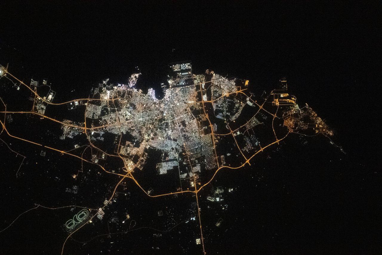 iss068e026585 (Dec. 4, 2022) --- The city lights of Doha, Qatar, are pictured on the coast of the Persian Gulf as the International Space Station orbited 258 miles above.