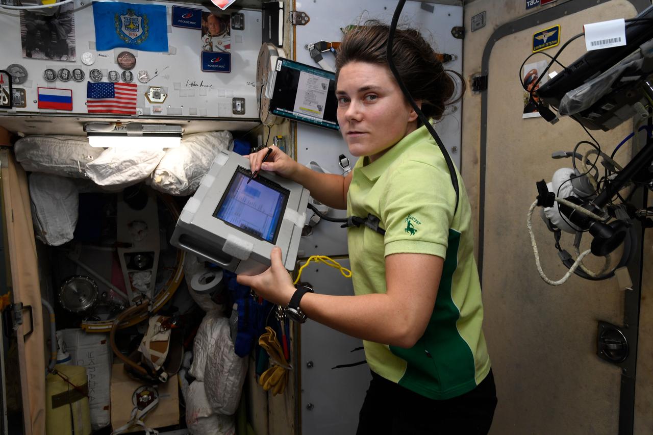 iss068e029379 (Dec. 12, 2022) --- Roscosmos cosmonaut and Expedition 68 Flight Engineer Anna Kikina is pictured inside the Zvezda service module filling out a computerized report at the end of her work day.