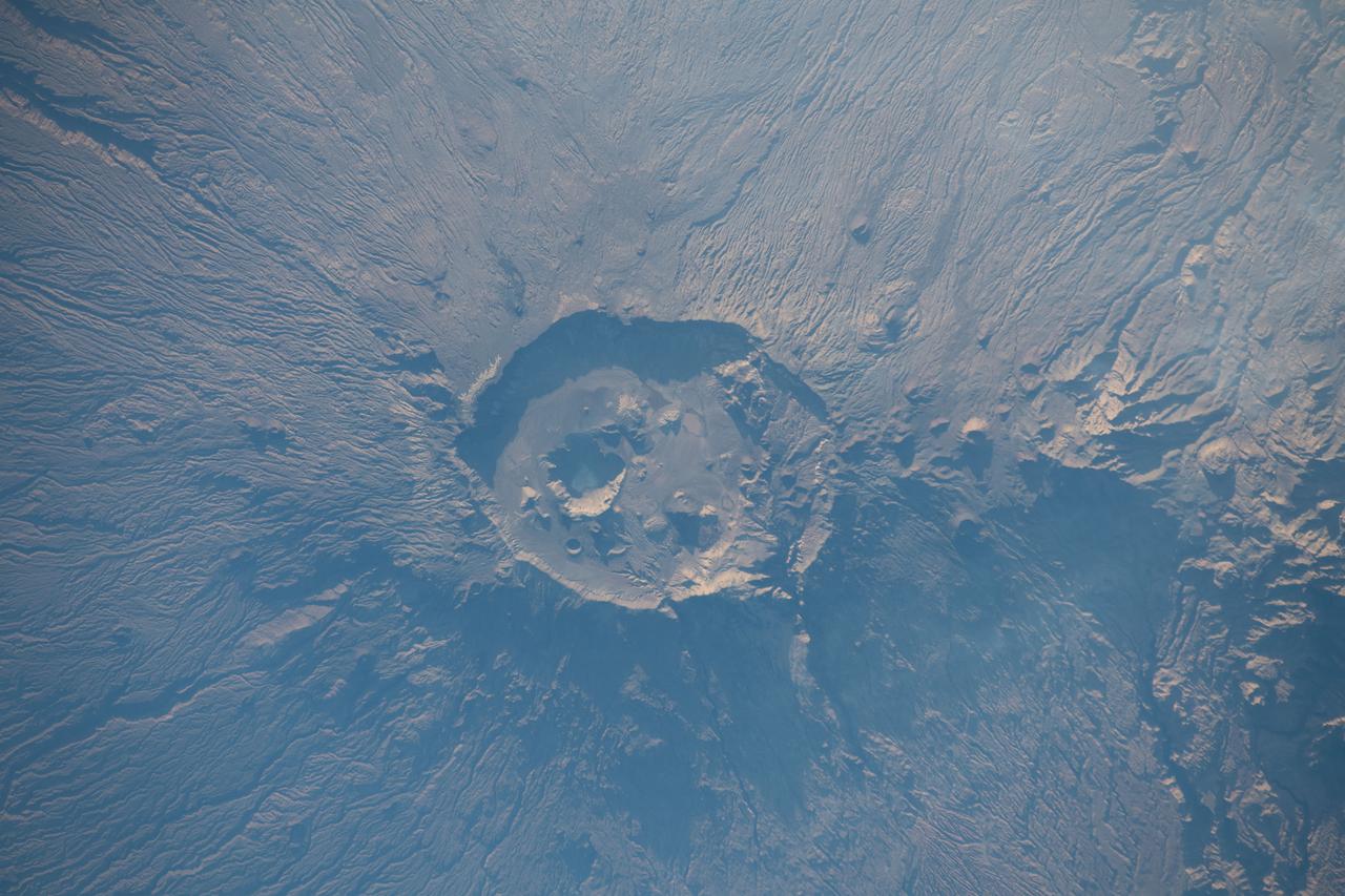 iss068e029498 (Dec. 13, 2022) --- Emi Koussi, a volcano and the highest peak in the Tibesti Mountains of Chad, was photographed from the International Space Station as it orbited 257 miles above Africa.
