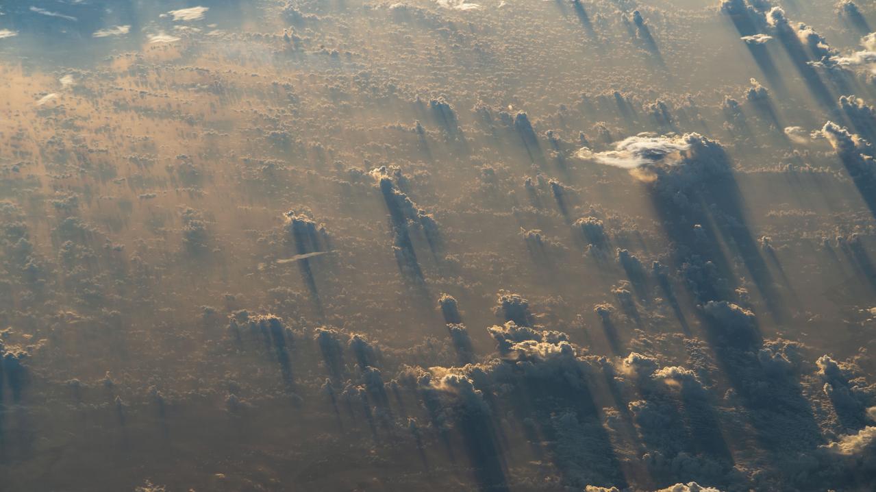 iss068e040120 (Jan. 13, 2023) --- A sunset stretches cloud shadows over Tanzania in this photograph from the International Space Station as it orbited 259 miles above the African nation.