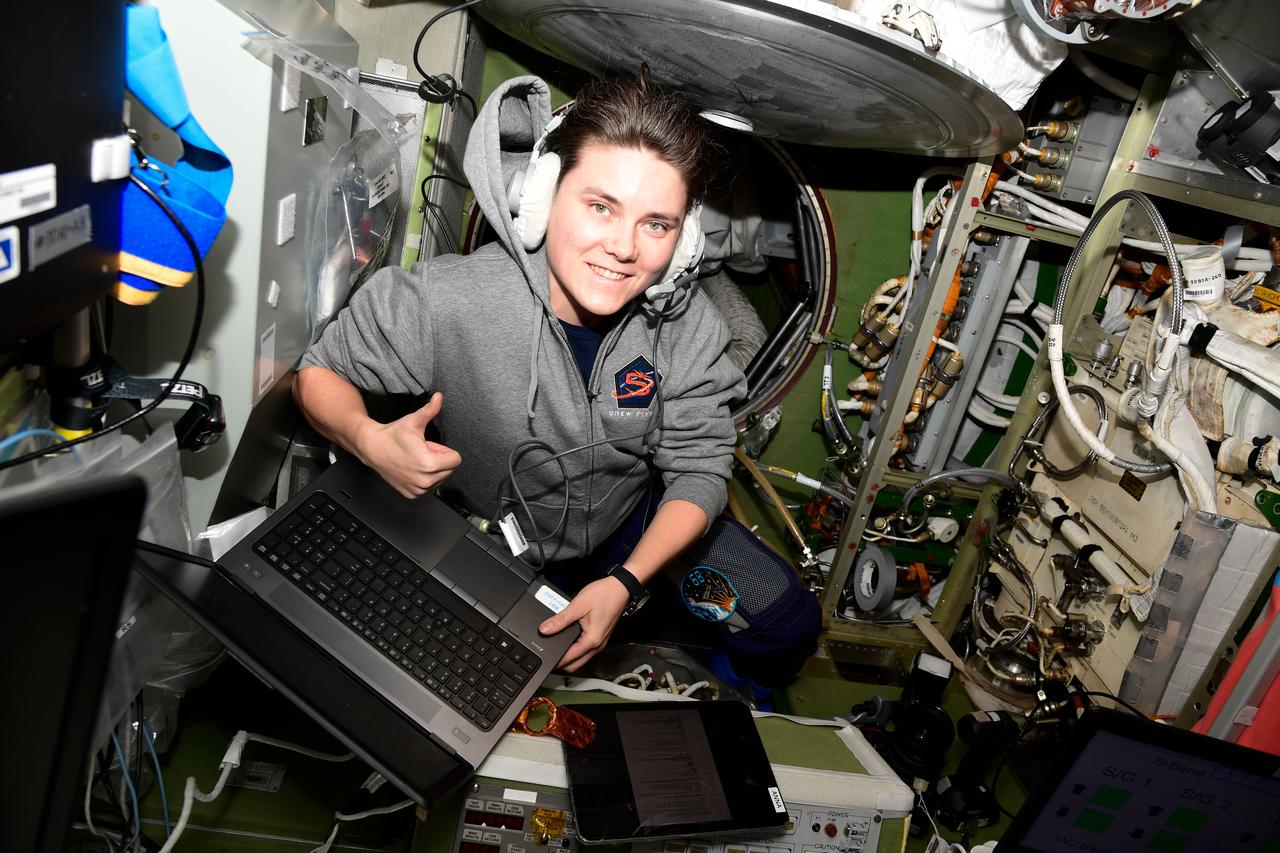 iss068e040300 (Jan. 16, 2023) --- Roscosmos cosmonaut and Expedition 68 Flight Engineer Anna Kikina checks procedures on a computer and works on life support maintenance tasks aboard the International Space Station.