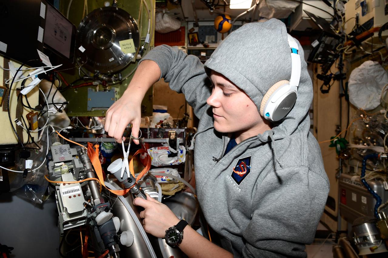 iss068e042980 (Jan. 26, 2023) --- Roscosmos cosmonaut and Expedition 68 Flight Engineer Anna Kikina works on orbital plumbing tasks inside the International Space Station. Credit: Roscosmos