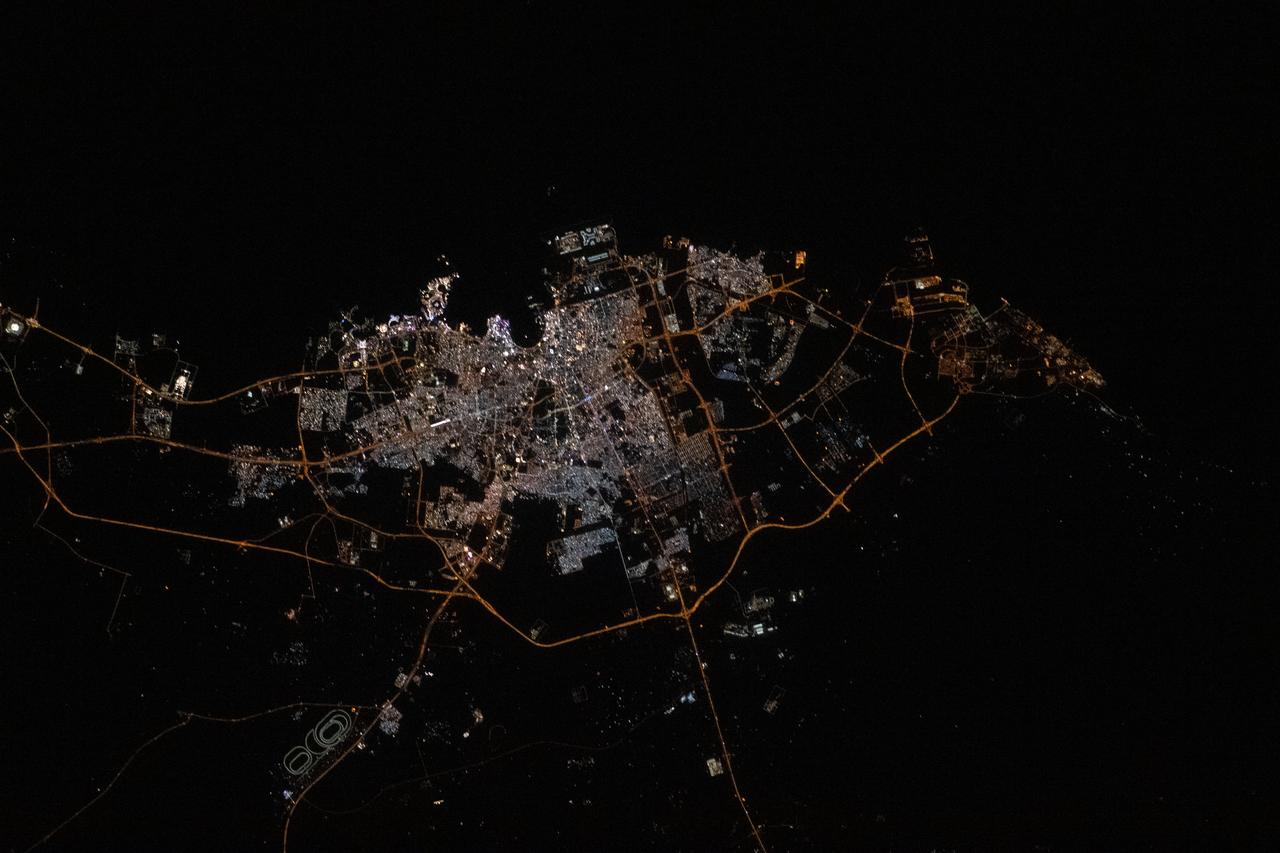 iss068e043827 (Jan. 30, 2023) --- The city lights of Doha, Qatar, are pictured from the International Space Station as it orbited 261 miles above the Arabian Peninsula.