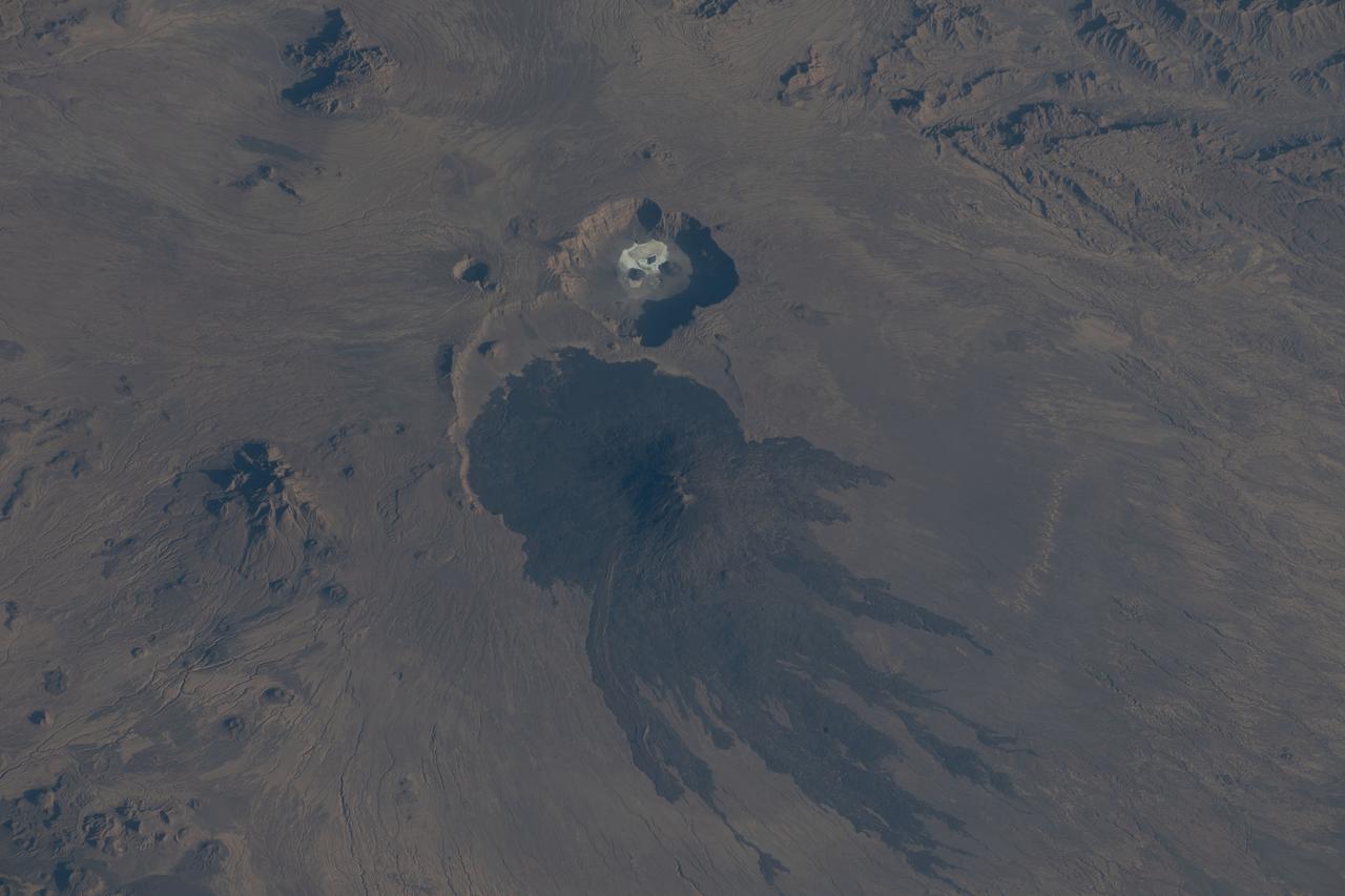 iss068e053501 (Feb. 12, 2023) --- The potentially active stratovolcano Toussidé and the Trou au Natron depression in the Tibesti Mountains are pictured from the International Space Station as it orbited 263 miles above the African nation of Chad.