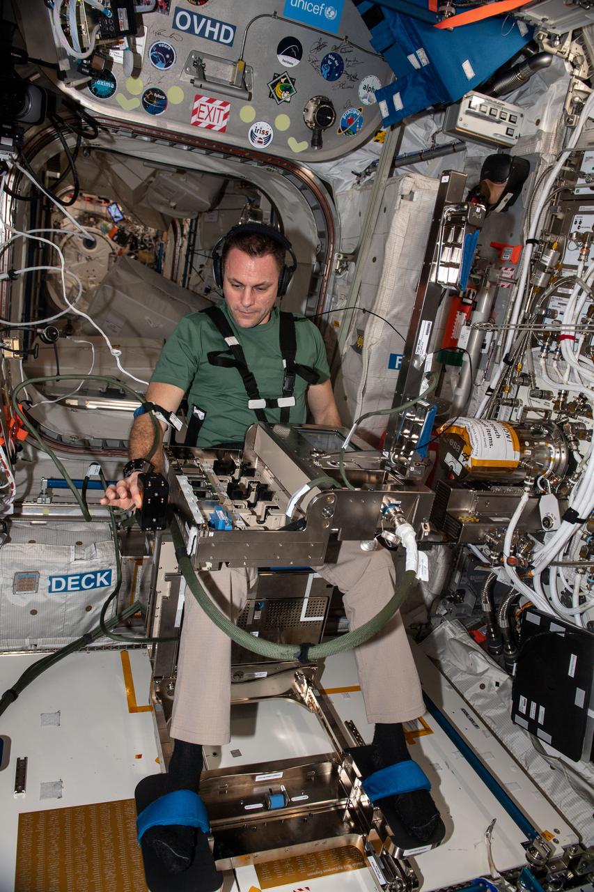 iss068e054122 (Feb. 14, 2023) --- Expedition 68 Flight Engineer Josh Cassada of NASA is seated in a specialized chair in the International Space Station's Columbus laboratory module for the GRIP human research experiment. The study investigates how astronauts regulate their grip force and move their arms when manipulating objects in microgravity in response to pre-programmed stimuli as a computer and video cameras record the responses.