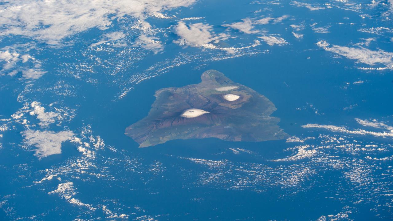 iss068e068973 (March 6, 2023) --- The big island of Hawaii and its two snow-capped volcanos, (from left) the active Mauna Loa and the dormant Mauna Kea, are pictured from the International Space Station as it orbited 260 miles above the Pacific Ocean.