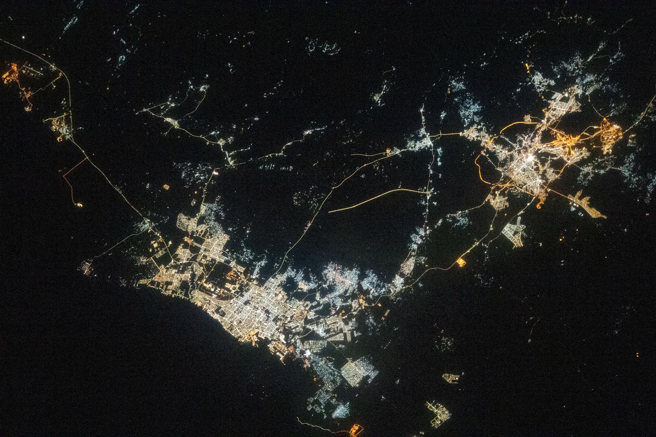 iss068e076629 (March 26, 2023) --- The night lights of the Saudi Arabian cities of Jeddah (lower left) and Mecca (upper right) contrast with the darkness of the Red Sea and the surrounding desert in this photograph from International Space Station as it orbited 258 miles above.