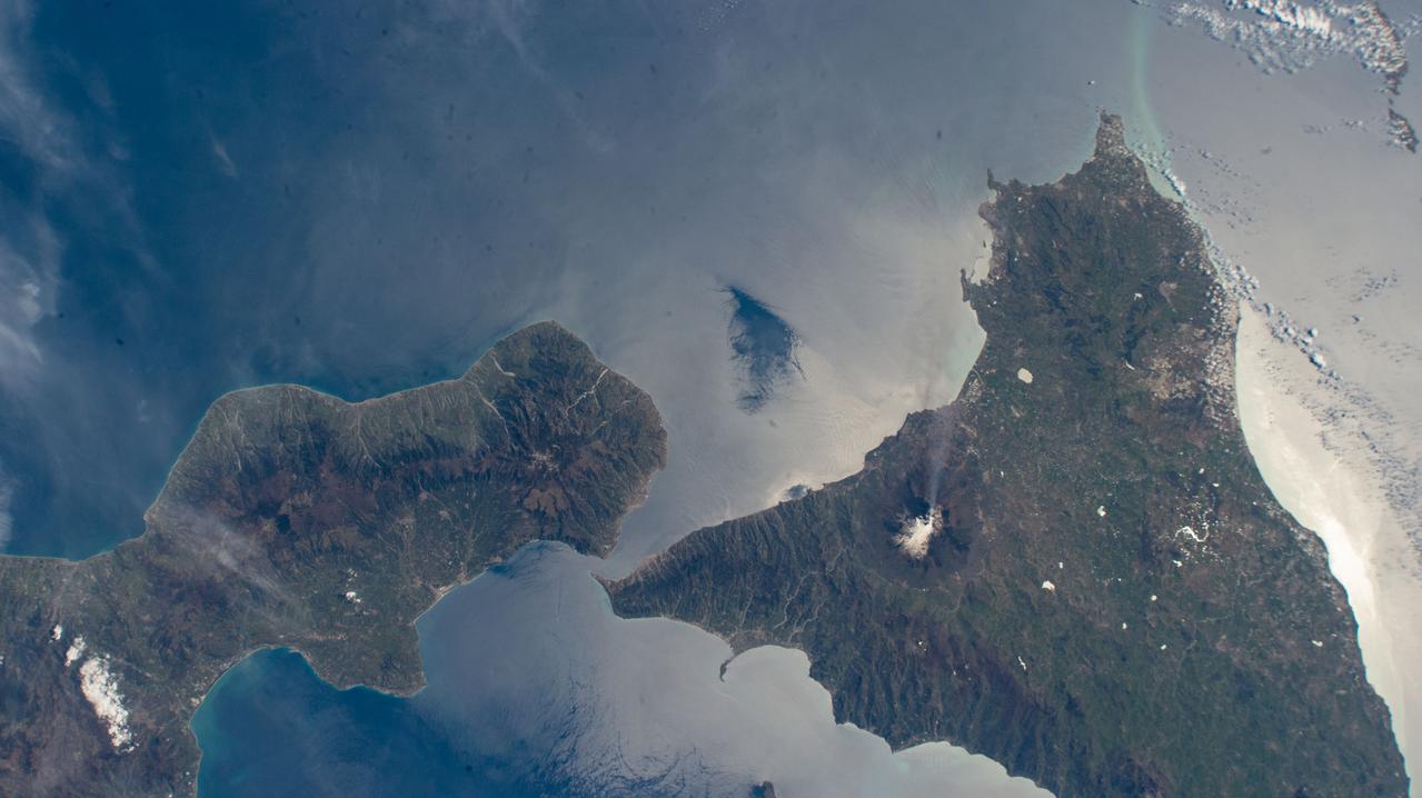 iss069e000129 (March 30, 2023) --- Mount Etna, an active stratovolcano on Italy's island of Sicily, billows smoke in this photograph from the International Space Station as it orbited 262 miles above.