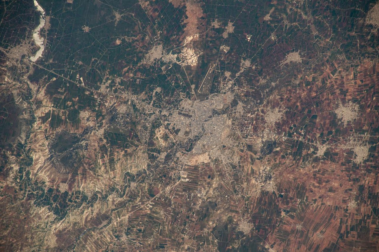 iss069e000778 (April 3, 2023) --- The semi-arid city of Hama, Syria, was pictured by UAE (United Arab Emirates) astronaut and Expedition 69 Flight Engineer Sultan Alneyadi from the International Space Station as it orbited 262 miles above.