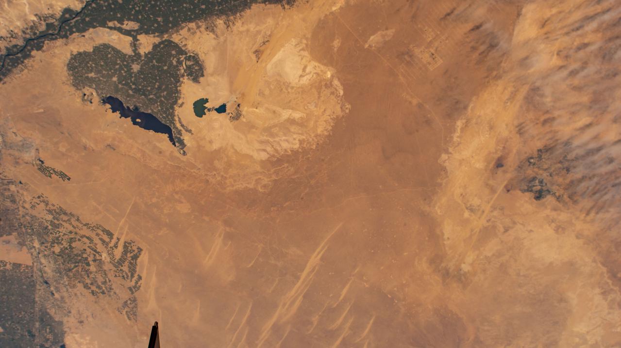 iss069e000819 (April 4, 2023) --- The Faiyum Oasis (upper left) in Egypt, immediately west of the Nile river and south of the nation's capital of Cairo, is pictured from an external high definition camera on the International Space Station as it orbited 262 miles above.
