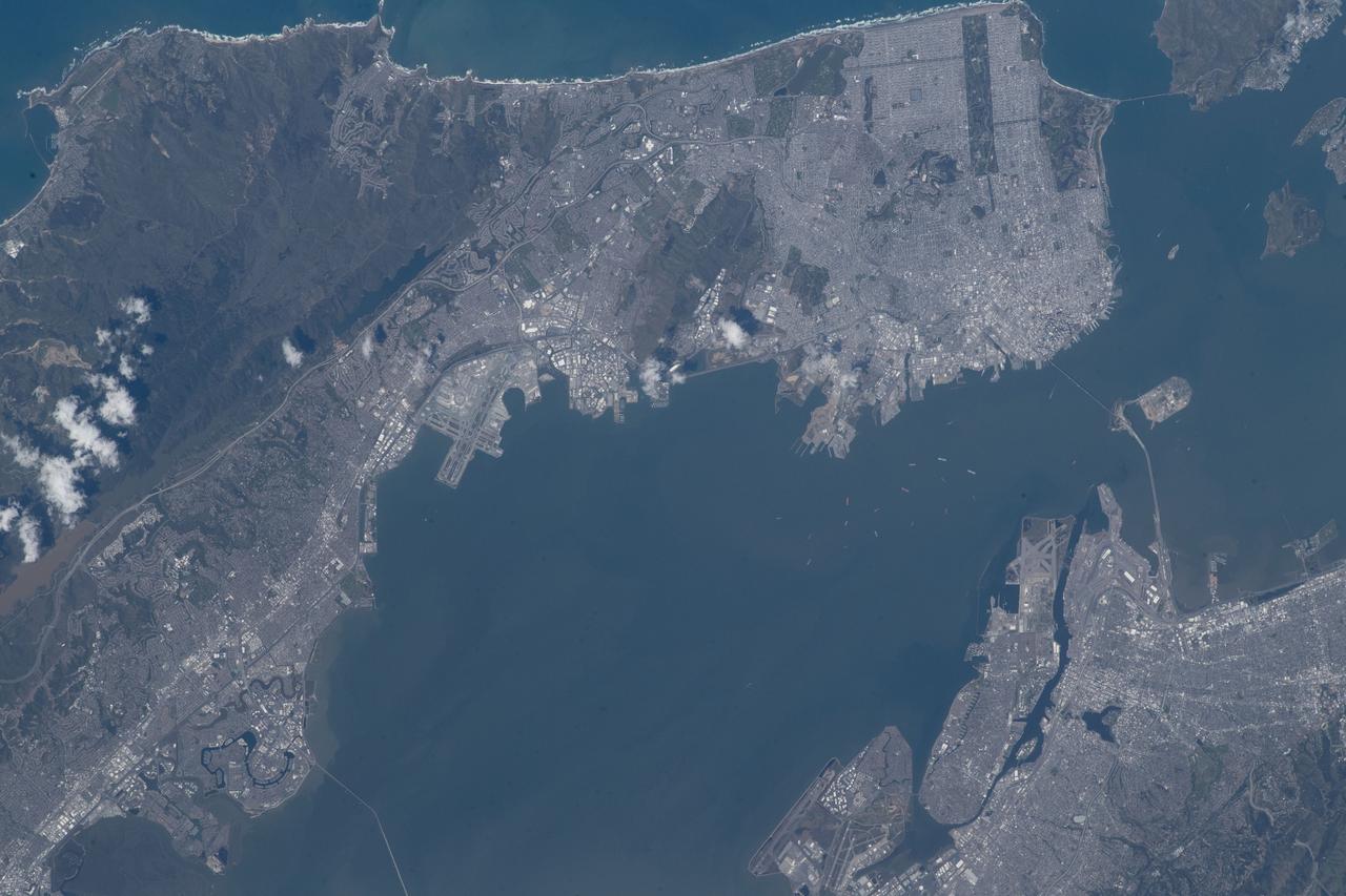 iss069e000857 (April 4, 2023) --- The California cities of San Francisco (top) and Oakland (bottom) separated by San Francisco Bay were pictured by NASA astronaut and Expedition 69 Flight Engineer Woody Hoburg from the International Space Station as it orbited 262 miles above.
