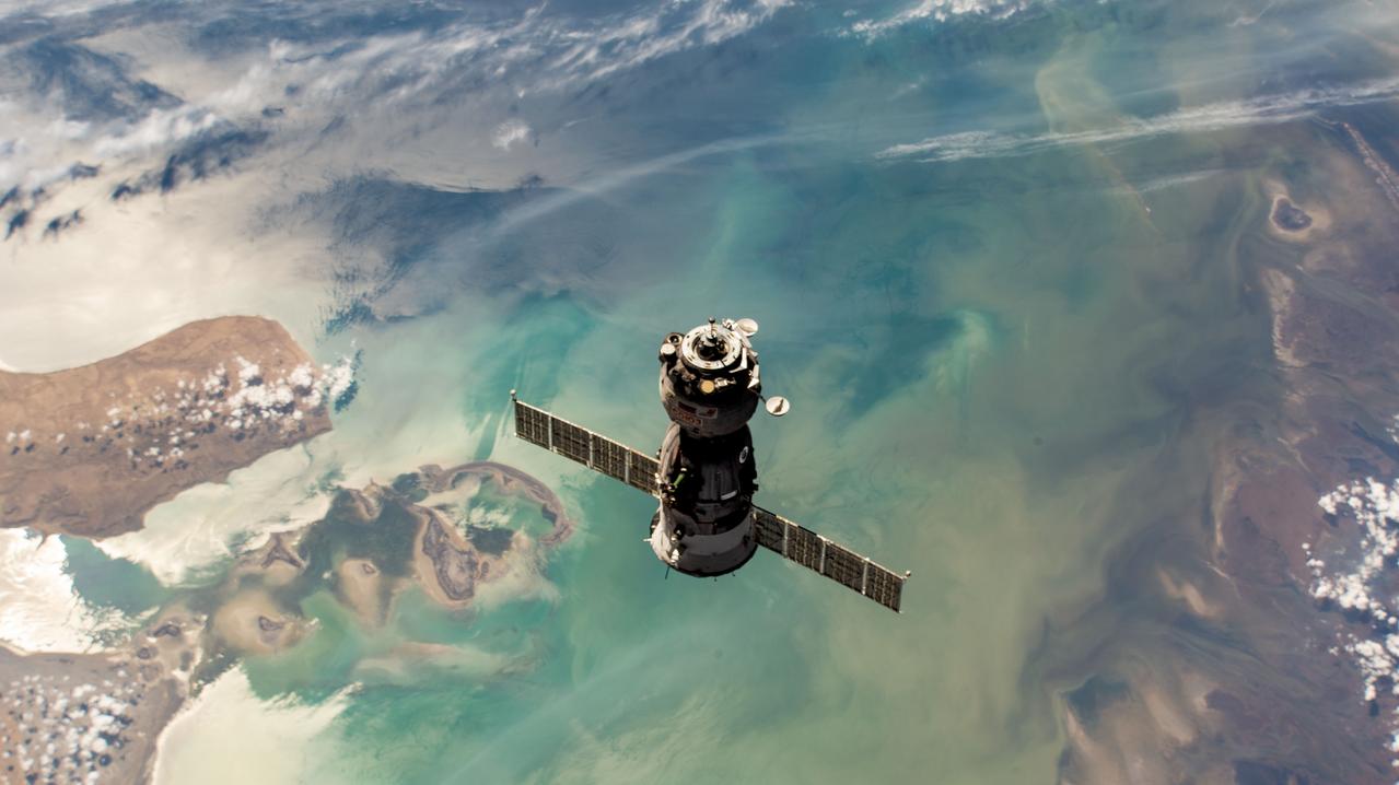 iss069e000991 (April 6, 2023) --- The Soyuz MS-23 crew ship approaches the International Space Station's Prichal docking module after undocking earlier from the Poisk module. Aboard the MS-23 during the 37-minute relocation maneuver were, NASA astronaut Frank Rubio with Roscosmos cosmonauts Sergey Prokopyev and Dmitri Petelin. Both spacecraft were orbiting 263 miles above the coast of the Caspian Sea in Kazakhstan at the time of this photograph.
