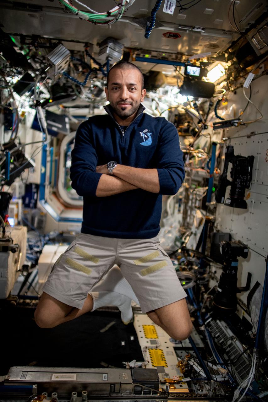 iss069e001193 (April 10, 2023) --- UAE (United Arab Emirates) astronaut and Expedition 69 Flight Engineer Sultan Alneyadi poses for a portrait with a new haircut aboard the International Space Station.