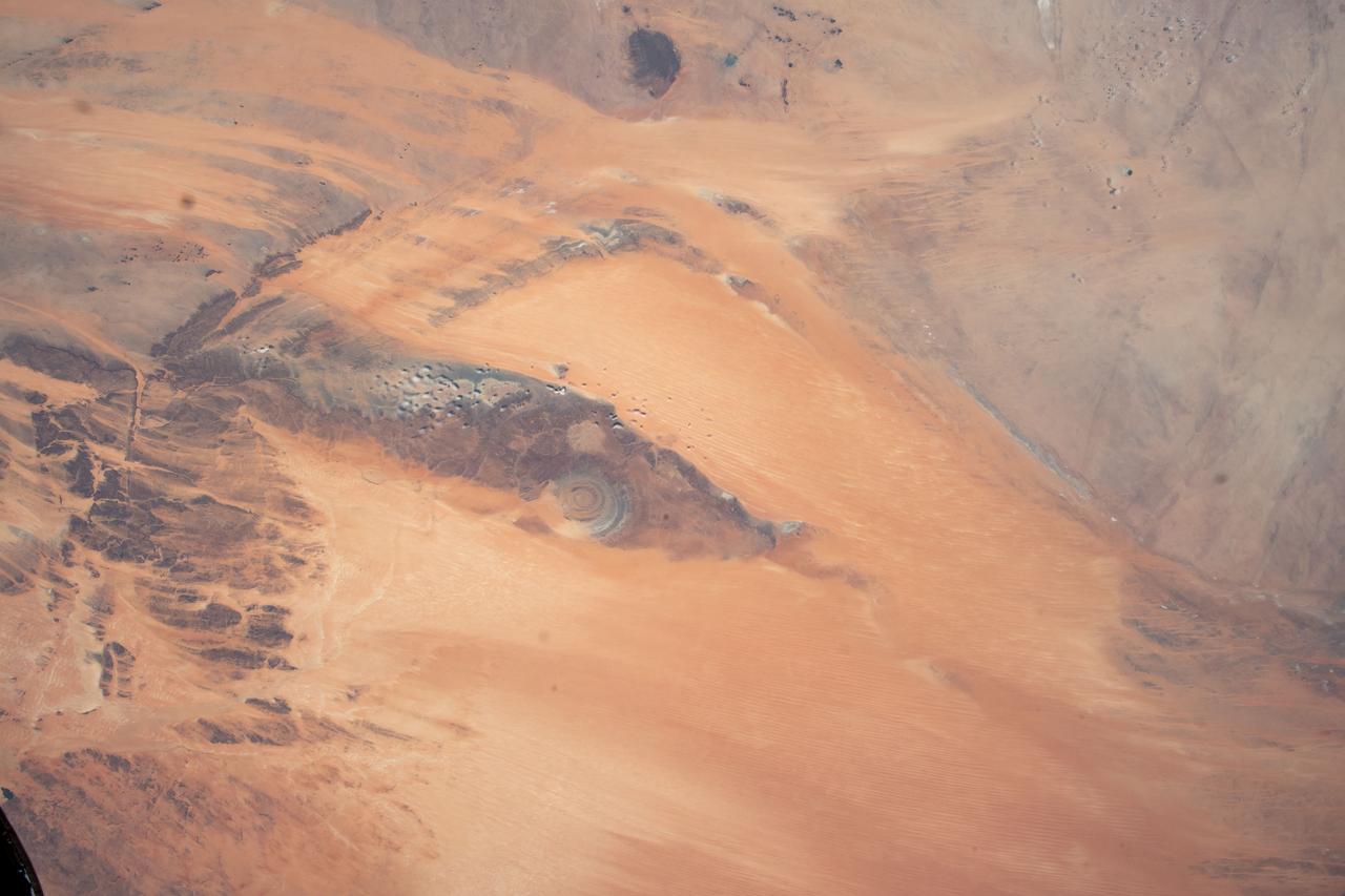 iss069e005526 (April 26, 2023) --- The Richat Structure, also known as the "Eye of the Sahara," an eroded geological dome in the nation of Mauritania, is pictured from the International Space Station as it orbited 259 miles above the African continent.