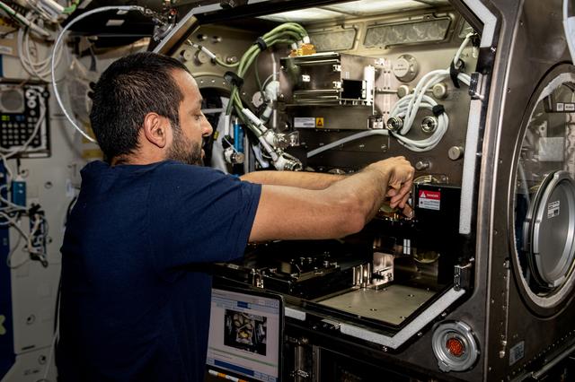 NASA image: Astronaut Sultan Alneyadi removes physics research hardware