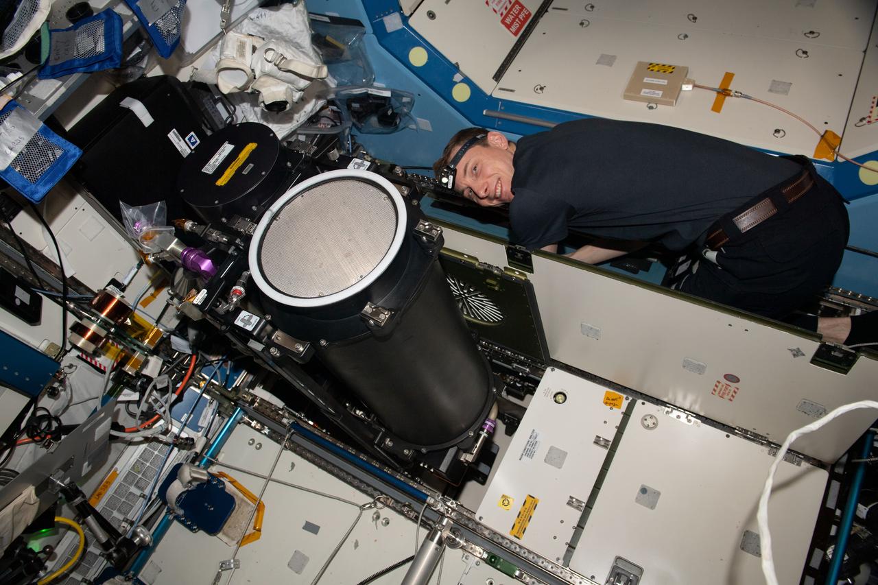iss069e009909 (May 9, 2023) --- NASA astronaut and Expedition 69 Flight Engineer Woody Hoburg works inside the International Space Station's Destiny laboratory module and replaces life support system components.