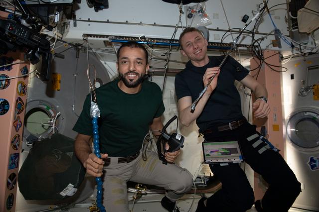 NASA image: Astronauts Sultan Alneyadi and Woody Hoburg show off tools