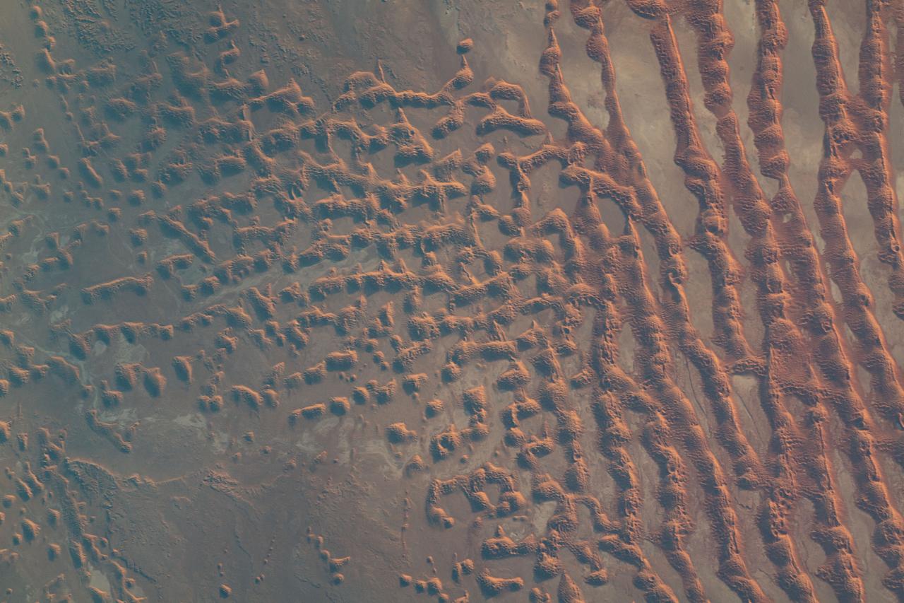 iss069e010867 (May 16, 2023) --- Sand dunes in the desert area along the Saudi Arabia-Oman border were pictured by UAE (United Arab Emirates) astronaut and Expedition 69 Flight Engineer Sultan Alneyadi from the International Space Station as it orbited 256 miles above.