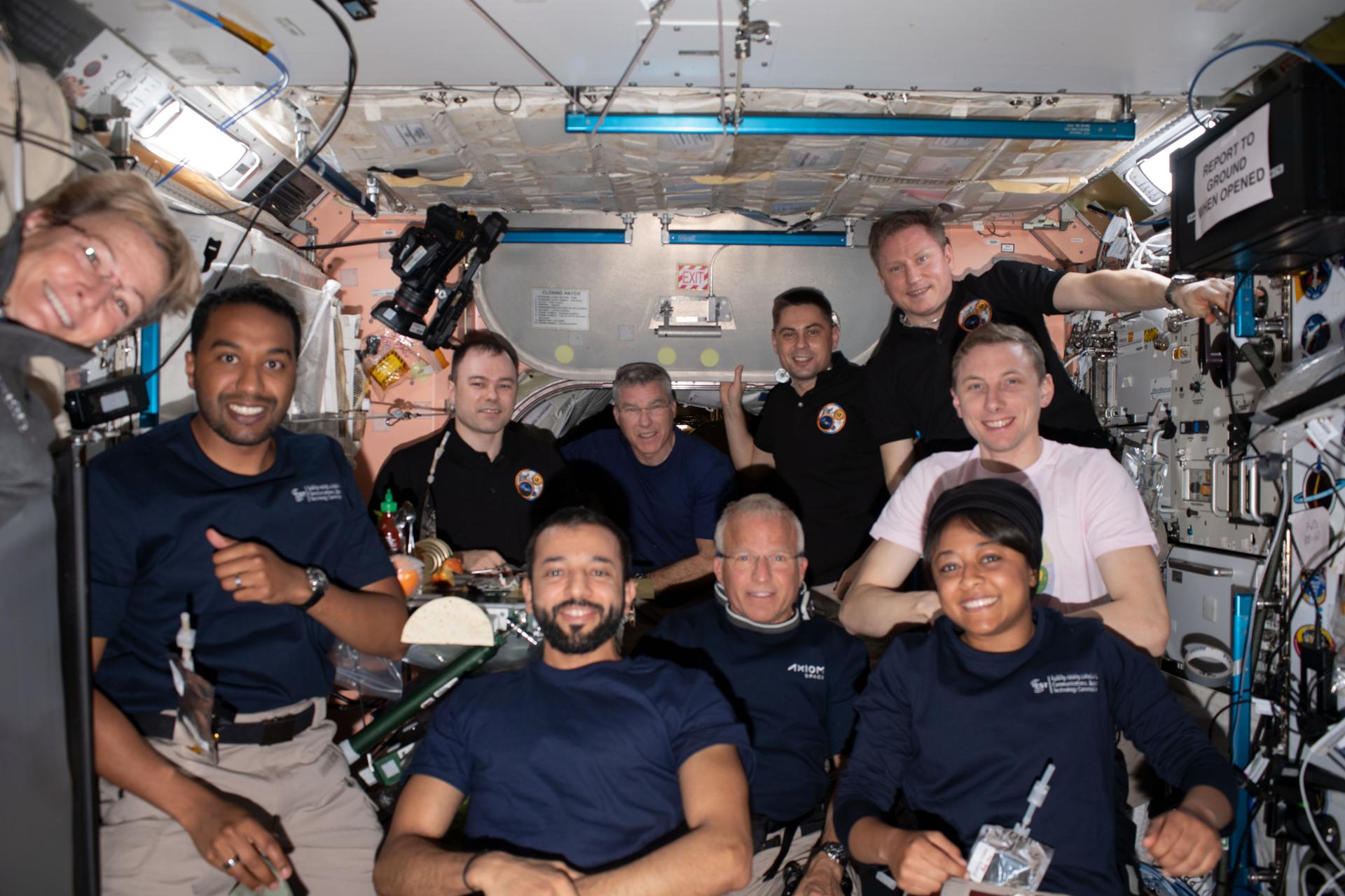 Crewmembers pose for a group photo inside the space station