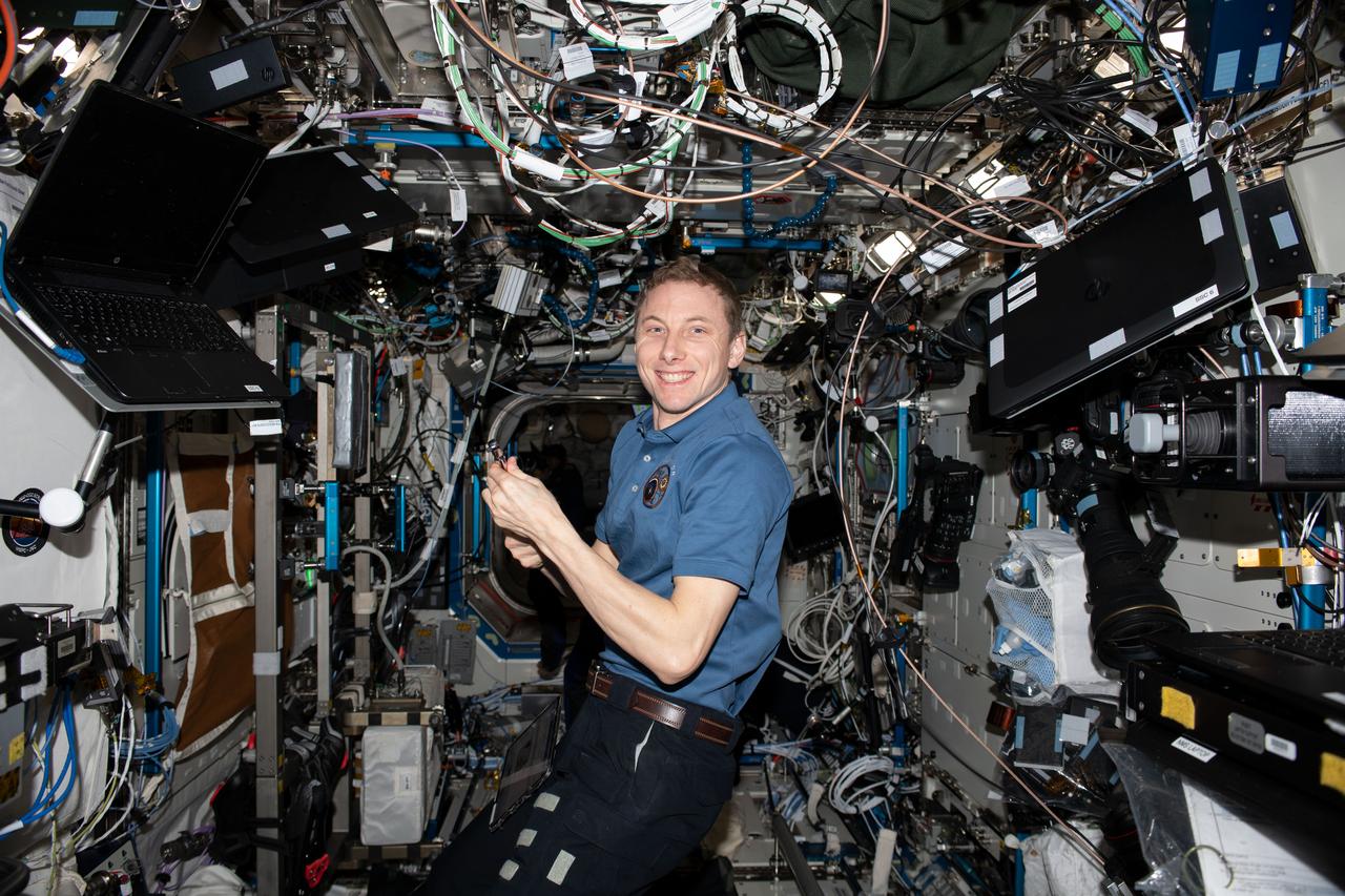 iss069e014216 (May 23, 2023) --- NASA astronaut and Expedition 69 Flight Engineer Woody Hoburg poses for a portrait during maintenance activities aboard the International Space Station.