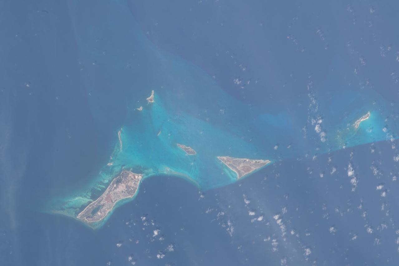 iss069e025034 (June 23, 2023) -- While only eight are inhabited, the Turks and Caicos are home to 40 different islands and cays. As the International Space Station orbited 258 miles above the region on June 23, 2023, United Arab Emirates astronaut and Expedition 69 crew member Sultan Alneyadi captured this photo of Cockburn Town (the Capital of Turks and Caicos Islands), Salt Cay and Cotton Cay.