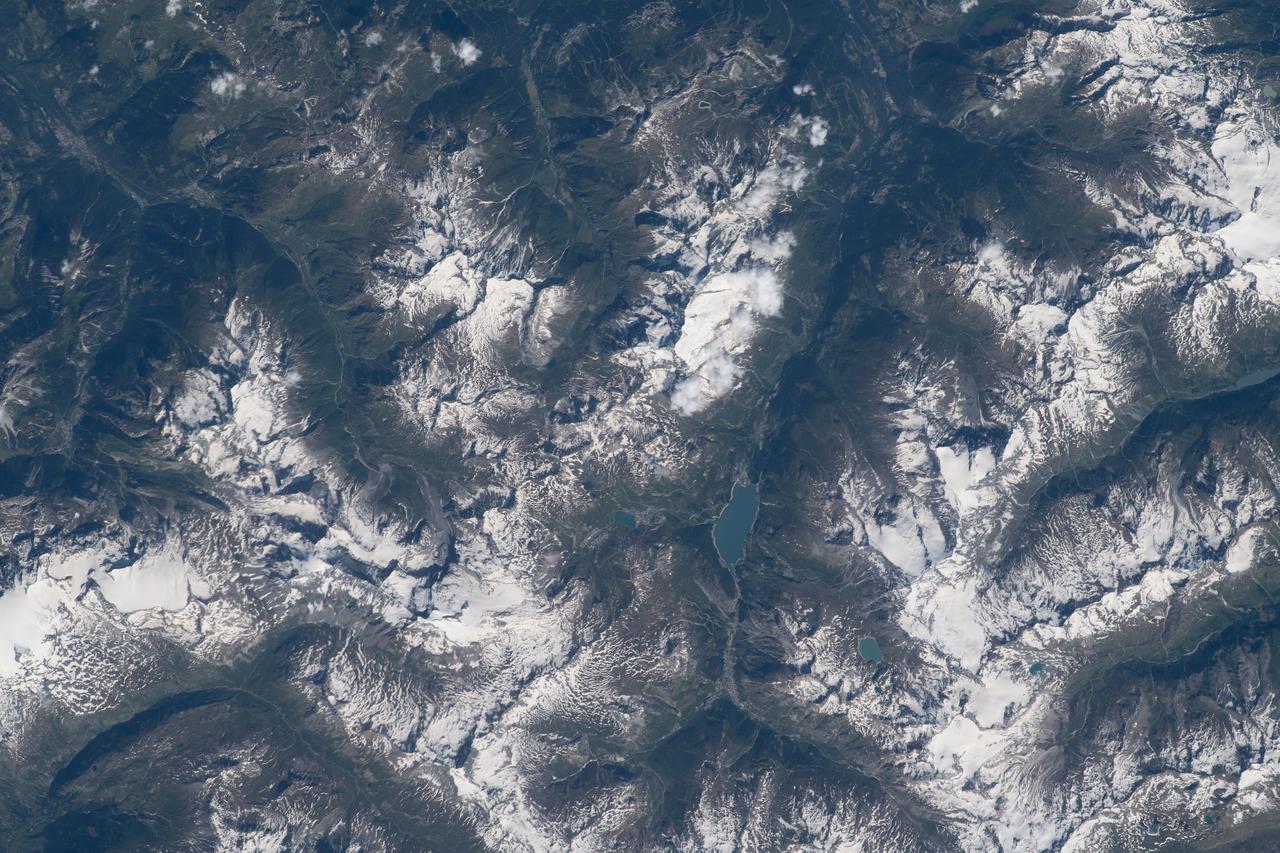 iss069e025220 (June 26, 2023) -- Lac du Chevril (Lake of the Chevril), located in the Auvergne-Rhône-Alpes, is pictured as the International Space Station orbited 260 miles above Southeastern France.