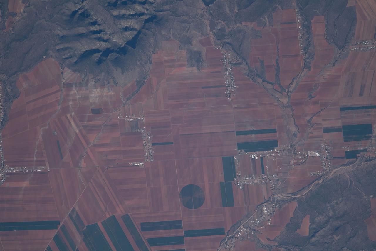 iss069e028764 (July 4, 2023) --- Agricultural activities on the outskirts of the Sierra de Majalca mountain range in the Mexican State of Chihuahua are pictured from the International Space Station as it orbited 257 miles above.