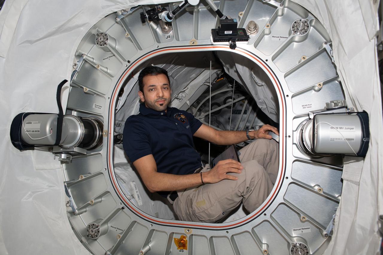 iss069e029193 (July 5, 2023) --- UAE (United Arab Emirates) astronaut and Expedition 69 Flight Engineer Sultan Alneyadi poses for a portrait inside the Bigelow Expandable Activity Module, or BEAM.