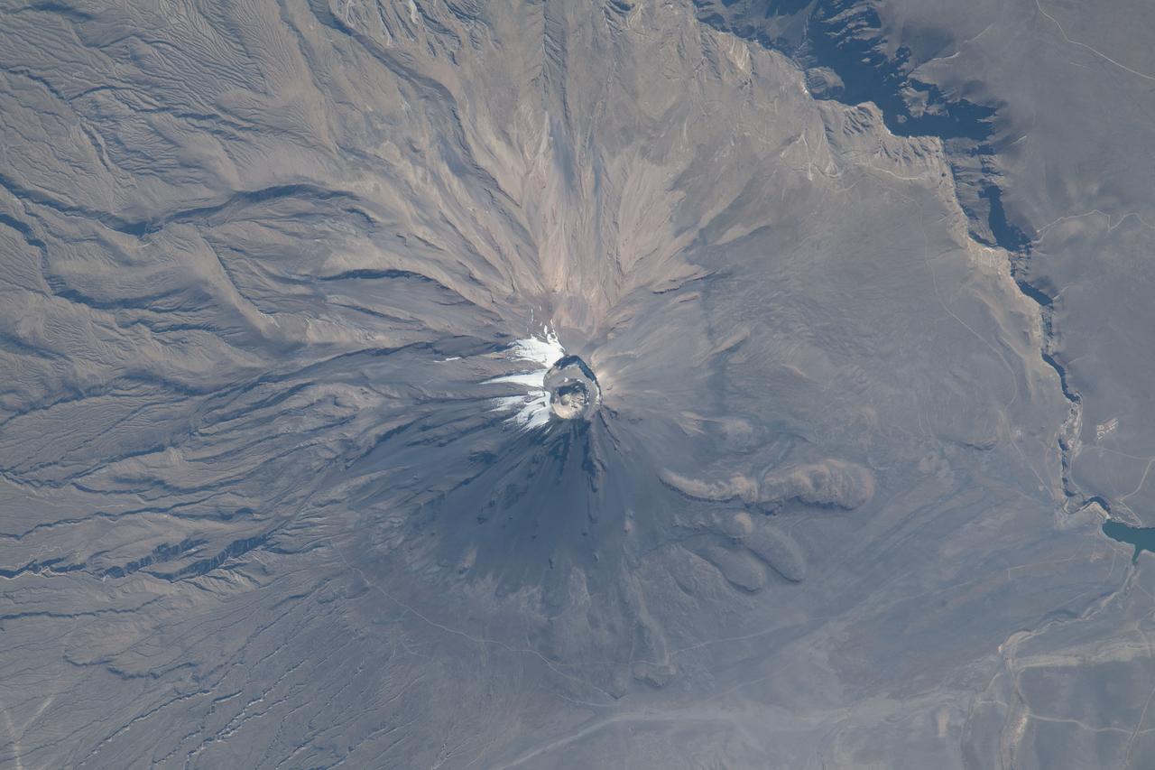 iss069e033636 (July 19, 2023) -- El Misti Volcano, which towers 5,822 meters (19,100 feet) high, is characterized by alternating layers of lava and debris from explosive eruptions. The International Space Station orbited 262 miles above Peru as this photo was captured.