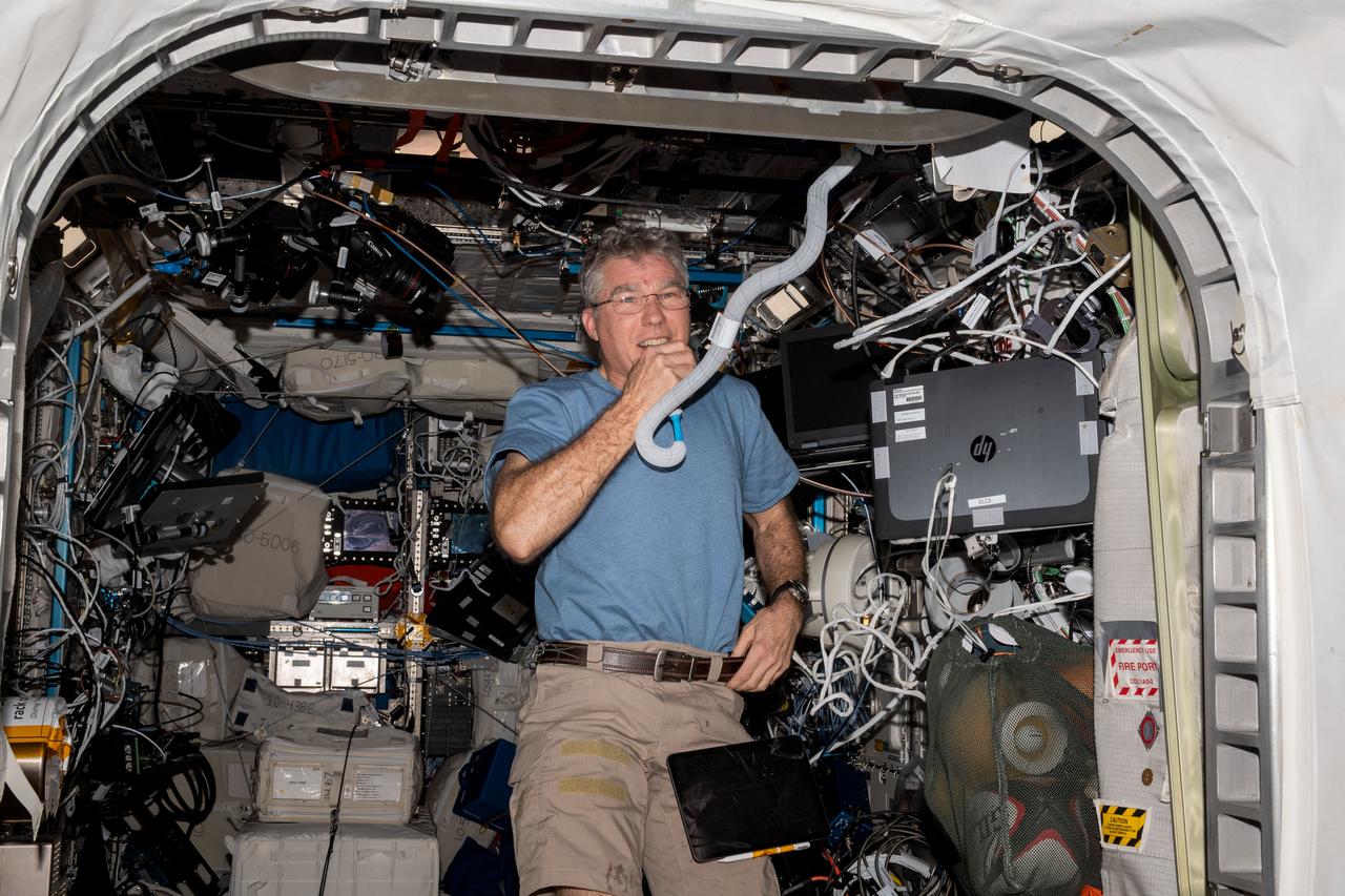 iss069e033736 (July 18, 2023) --- NASA astronaut and Expedition 69 Flight Engineer Stephen Bowen is pictured in the Columbus laboratory module conducting a HAM radio session with students from Carleton University in Ottawa, Ontario, in Canada.