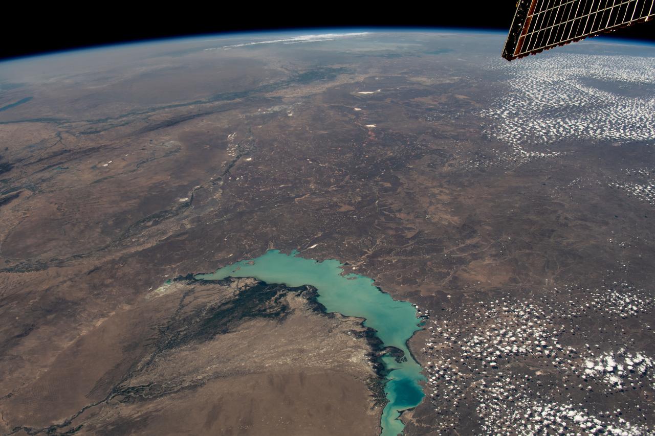 iss069e053802 (August 3, 2023) -- Lake Balkhash, one of the largest in Central Asia, spans roughly 6,500 square miles (17,000 square kilometers) in Kazakhstan. The western part of the lake holds fresh water whereas the eastern side of the basin is salty. The International Space Station soared 261 miles above as this image was taken.