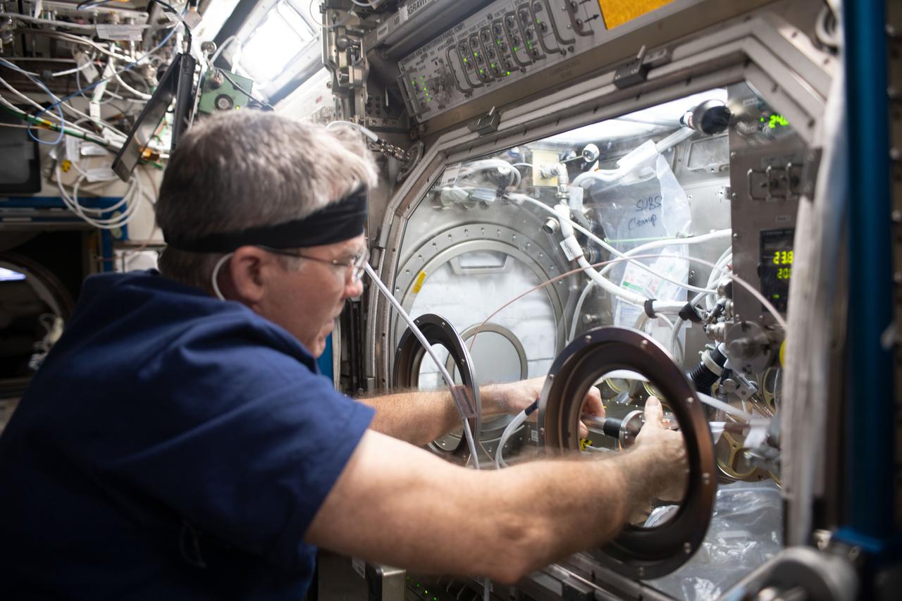 iss069e056172 (Aug. 11, 2023) --- NASA astronaut and Expedition 69 Flight Engineer Stephen Bowen works on physics research inside the Destiny laboratory module's Microgravity Science Glovebox. The SUBSA-μgGA investigation seeks to create a superior graphene aerogel, a synthetic material with high porosity and low density, in microgravity benefitting both Earth and space industries such as power storage, environmental protection, and chemical sensing.