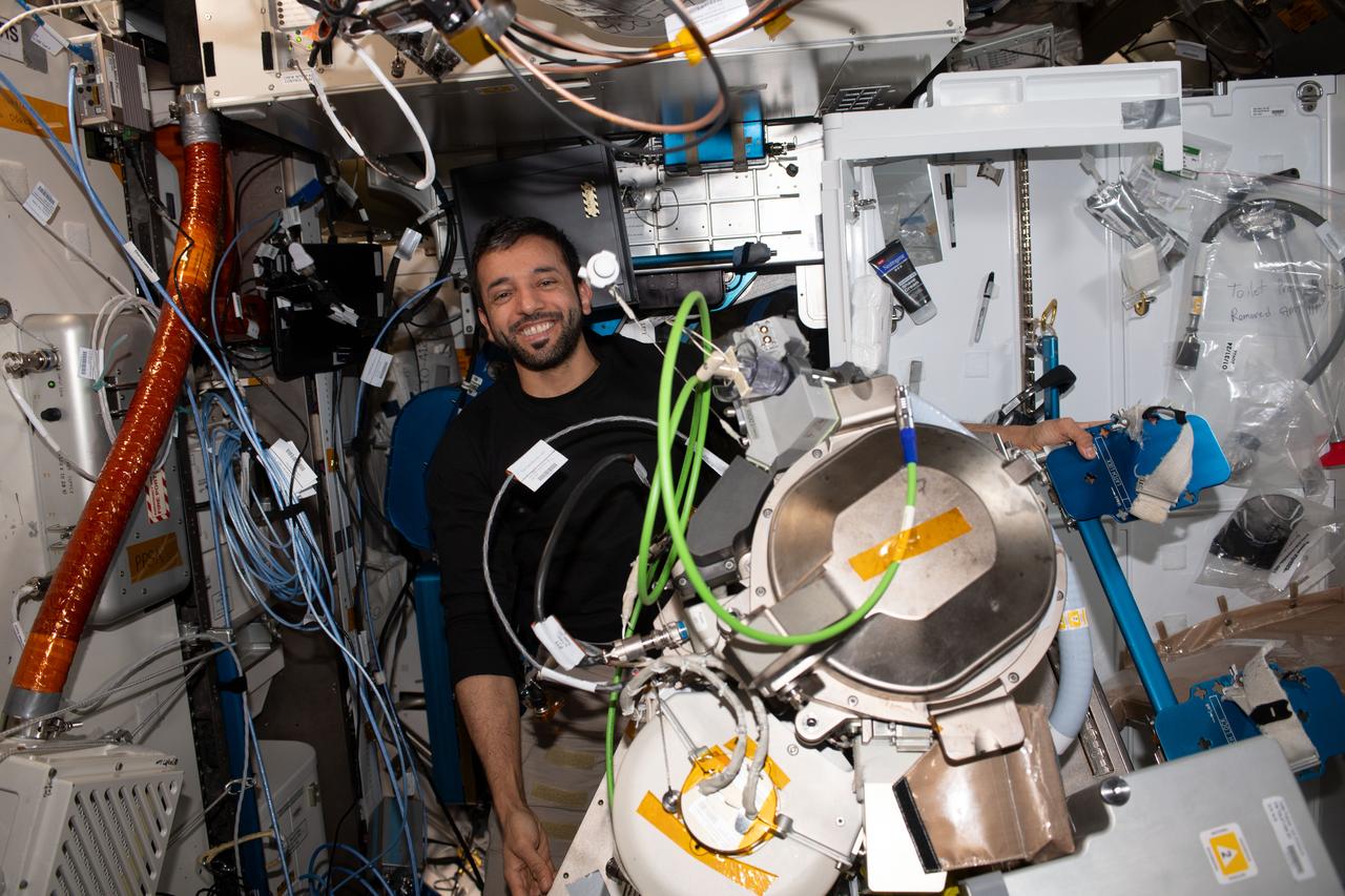 iss069e056737 (Aug. 11, 2023) --- UAE (United Arab Emirates) astronaut and Expedition 69 Flight Engineer Sultan Alneyadi replaces orbital plumbing components in the International Space Station's bathroom, or Waste and Hygiene Compartment, located in the Tranquility module.