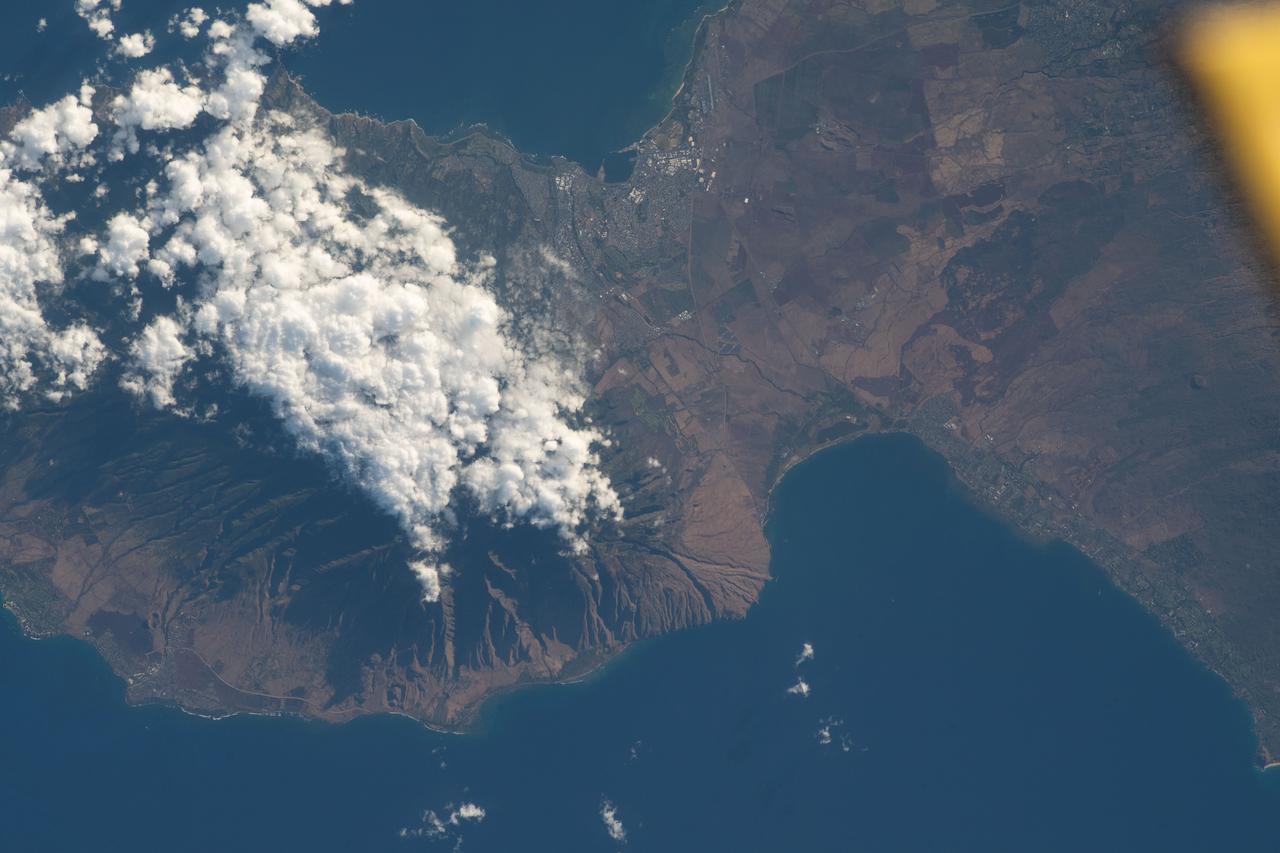 iss069e057179 (Aug. 12, 2023) --- The island of Maui, Hawaii, the scene of deadly wildfires and the especially hard hit coastal town of Lahaina (at lower left), is pictured from the International Space Station as it orbited 259 miles above the Pacific Ocean.