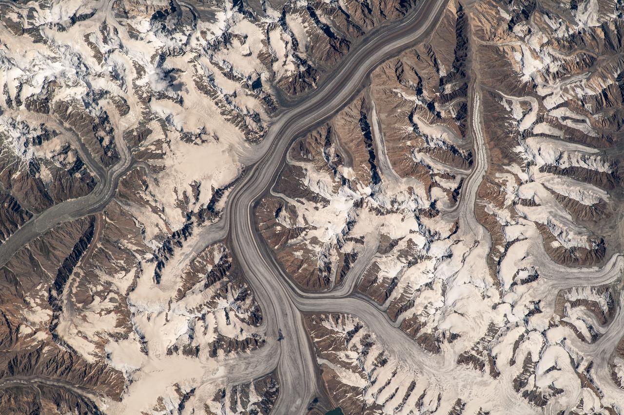 iss069e060329 (Aug. 15, 2023) --- Glaciers in the Pamir mountain range located in The Republic of Tajikistan are pictured from the International Space Station as it orbited 264 miles above Central Asia.