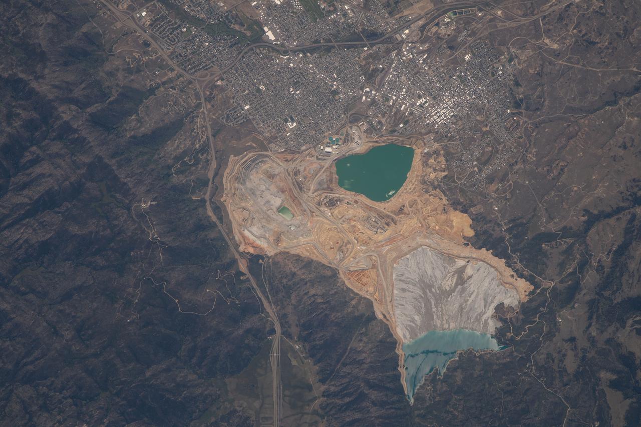 iss069e060850 (Aug. 15, 2023) --- The city of Butte, Montana, next to the Berkeley Pit and Yankee Doodle Tailings Pond, is pictured from the International Space Station as it orbited 265 miles above the Big Sky Country state.