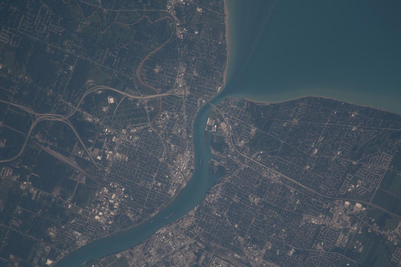 iss069e060965 (Aug. 16, 2023) --- The St. Clair River separates the American city of Port Huron, Michigan (left), from the Canadian city of Sarnia, Ontario (right), and enters into Lake Huron in this photograph from the International Space Station as it orbited 263 miles above.
