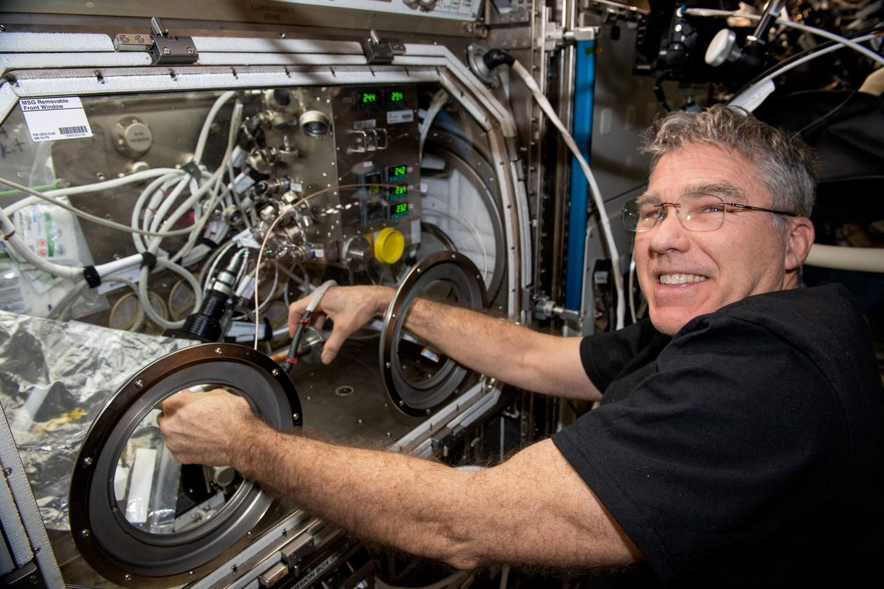 iss069e061597 (Aug. 17, 2023) --- NASA astronaut and Expedition 69 Flight Engineer Stephen Bowen works in the Microgravity Science Glovebox swapping graphene aerogel samples for a space manufacturing study. The physics investigation seeks to produce a superior, uniform material structure benefitting power storage, environmental protection, and chemical sensing.