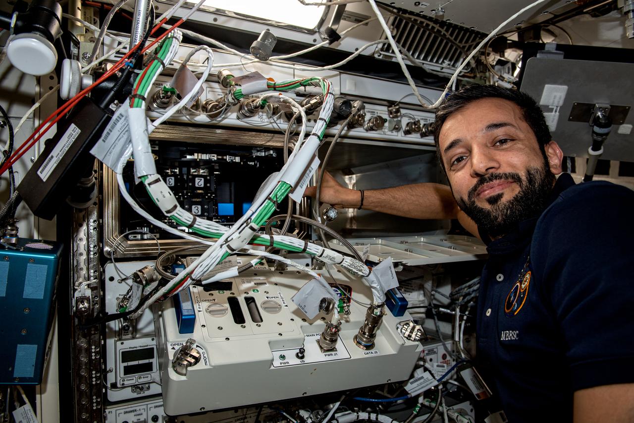 iss069e062399 (Aug. 18, 2023) --- UAE (United Arab Emirates) astronaut and Expedition 69 Flight Engineer Sultan Alneyadi works on space biology research hardware located inside the International Space Station's Kibo laboratory module.