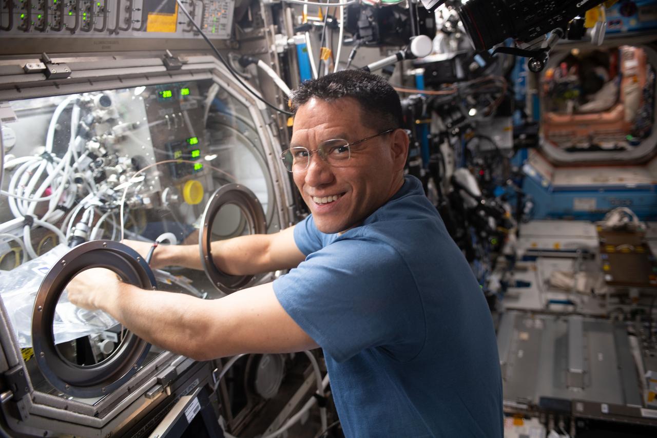 iss069e070724 (Aug. 21, 2023) --- NASA astronaut and Expedition 69 Flight Engineer Frank Rubio works in the Microgravity Science Glovebox swapping graphene aerogel samples for a space manufacturing study. The physics investigation seeks to produce a superior, uniform material structure benefitting power storage, environmental protection, and chemical sensing.
