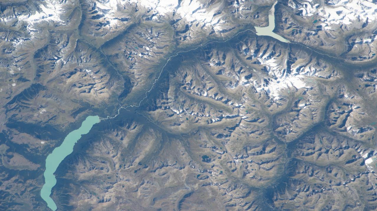 iss069e071176 (Aug. 20, 2023) --- Ka Nasi Lake (lower left) and Ake Kule Lake (upper right), in China's Altai Mountain range near Mongolia's far western border, are pictured in this photograph as the International Space Station orbited 265 miles above.